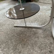 Coffee oval table with metal legs and smoky glass top, 1990s