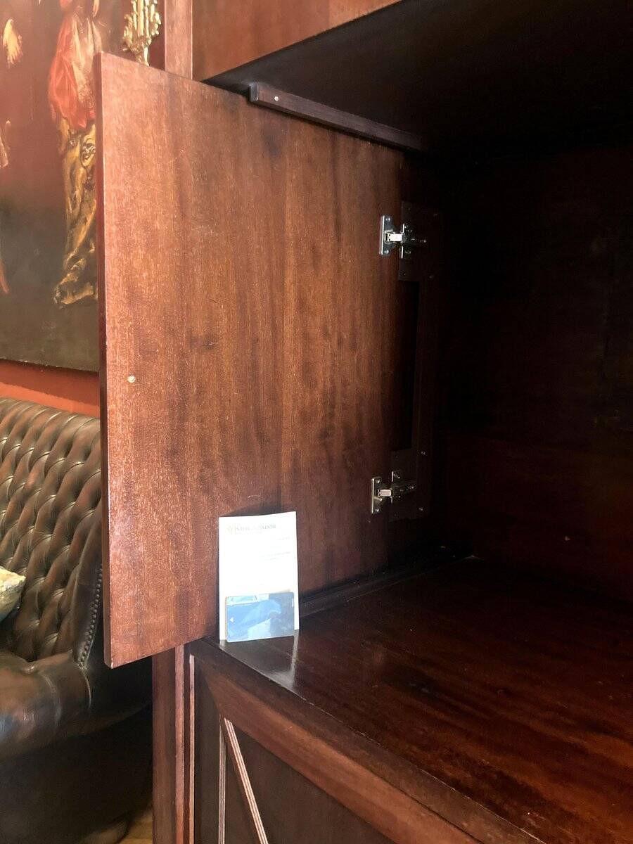 Cabinet, wardrobe or mahogany and ormolu wine bar in French Empire style with four doors.