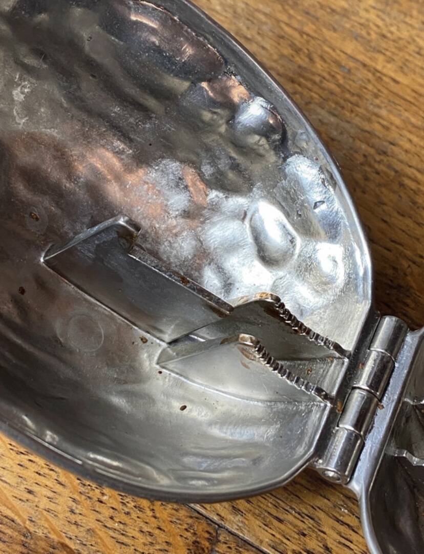 Nutcracker, shaped like a large nut, silver-plated metal