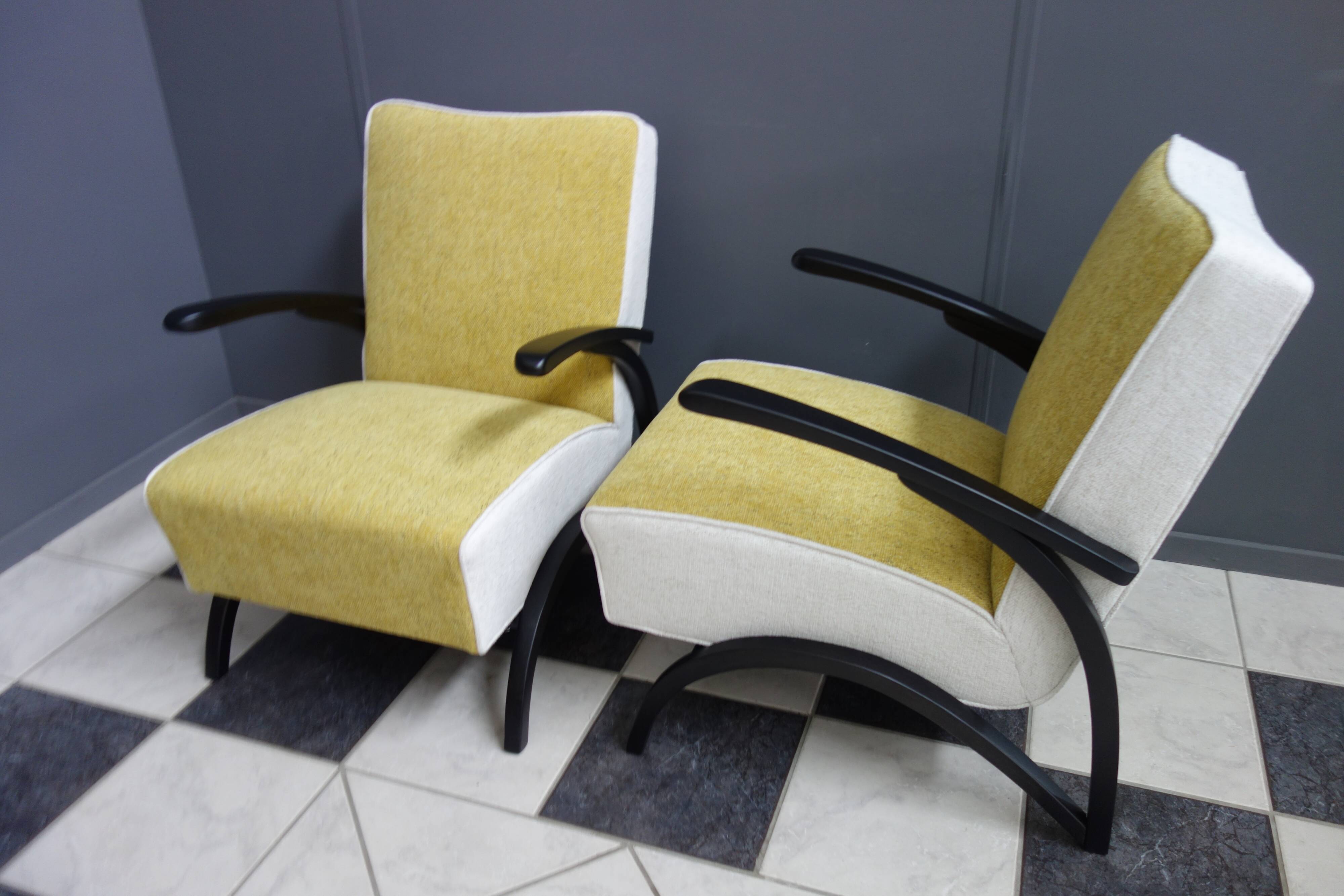 Jindrich halabala chairs yellow and white