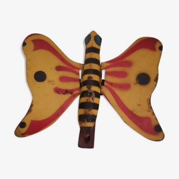 Old mechanical butterfly toy made of sheet metal