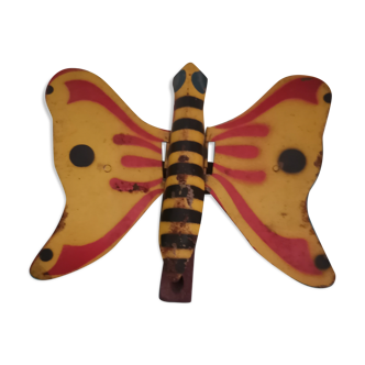 Old mechanical butterfly toy made of sheet metal