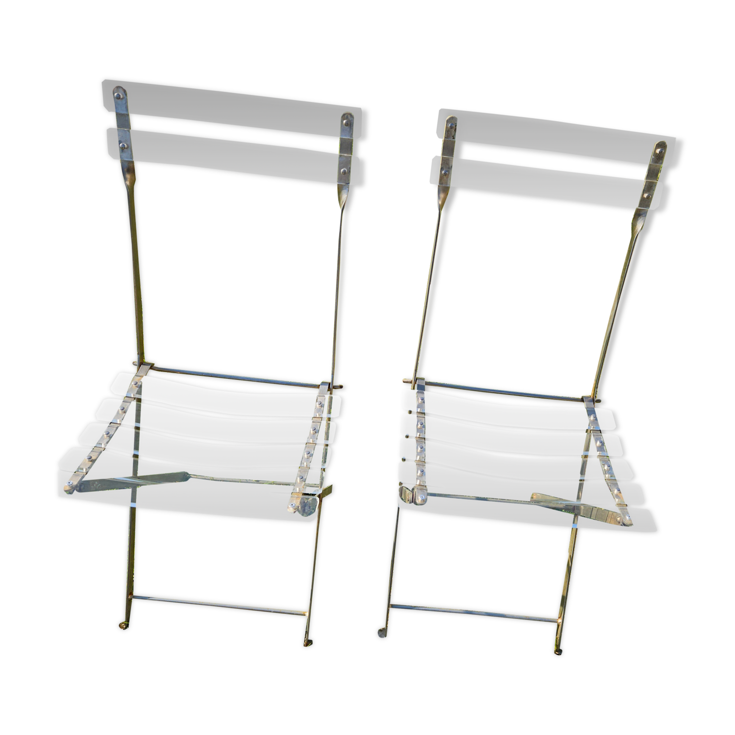 2 invisible folding chairs in metal and transparent plexiglass