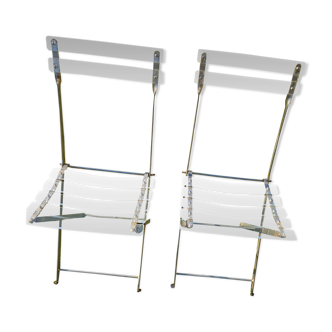 2 invisible folding chairs in metal and transparent plexiglass