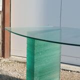 Solid glass desk with a half-moon top.