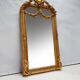 Miroir baroque doré avec guirlande de fleurs