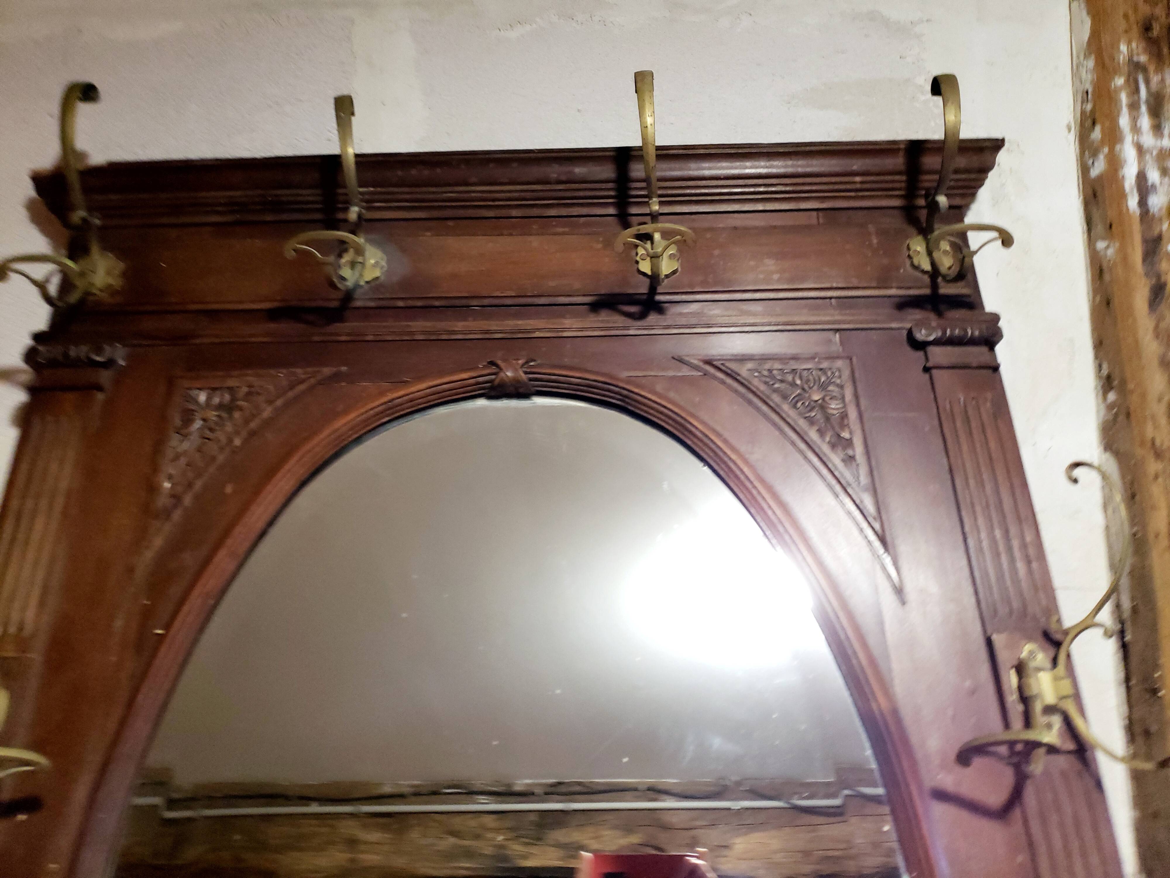 Coat rack with oval mirror