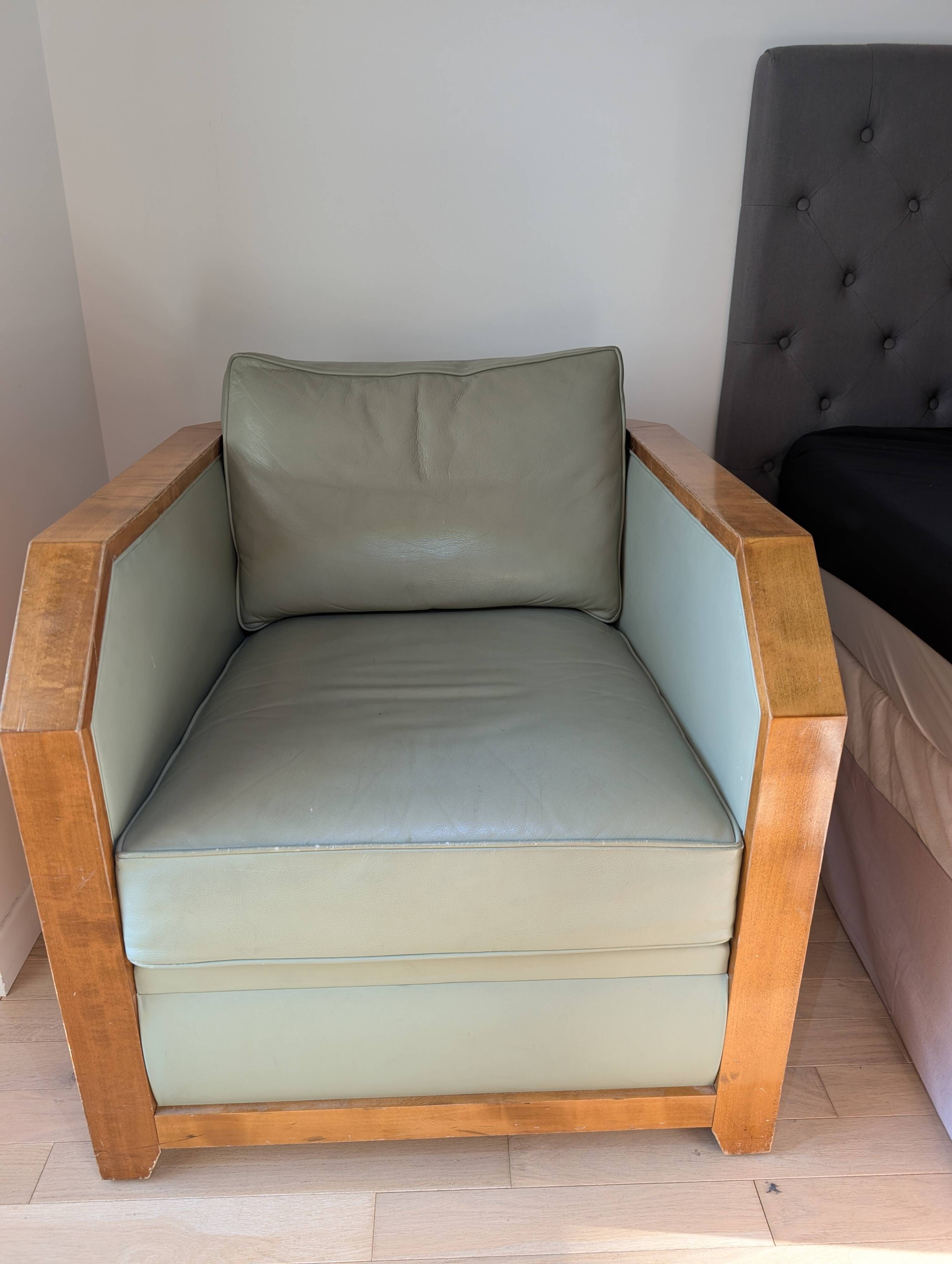 Vintage armchair Hugues Chevalier Paris — Almond green leather & Wood