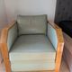 Vintage armchair Hugues Chevalier Paris — Almond green leather & Wood