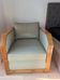Vintage armchair Hugues Chevalier Paris — Almond green leather & Wood