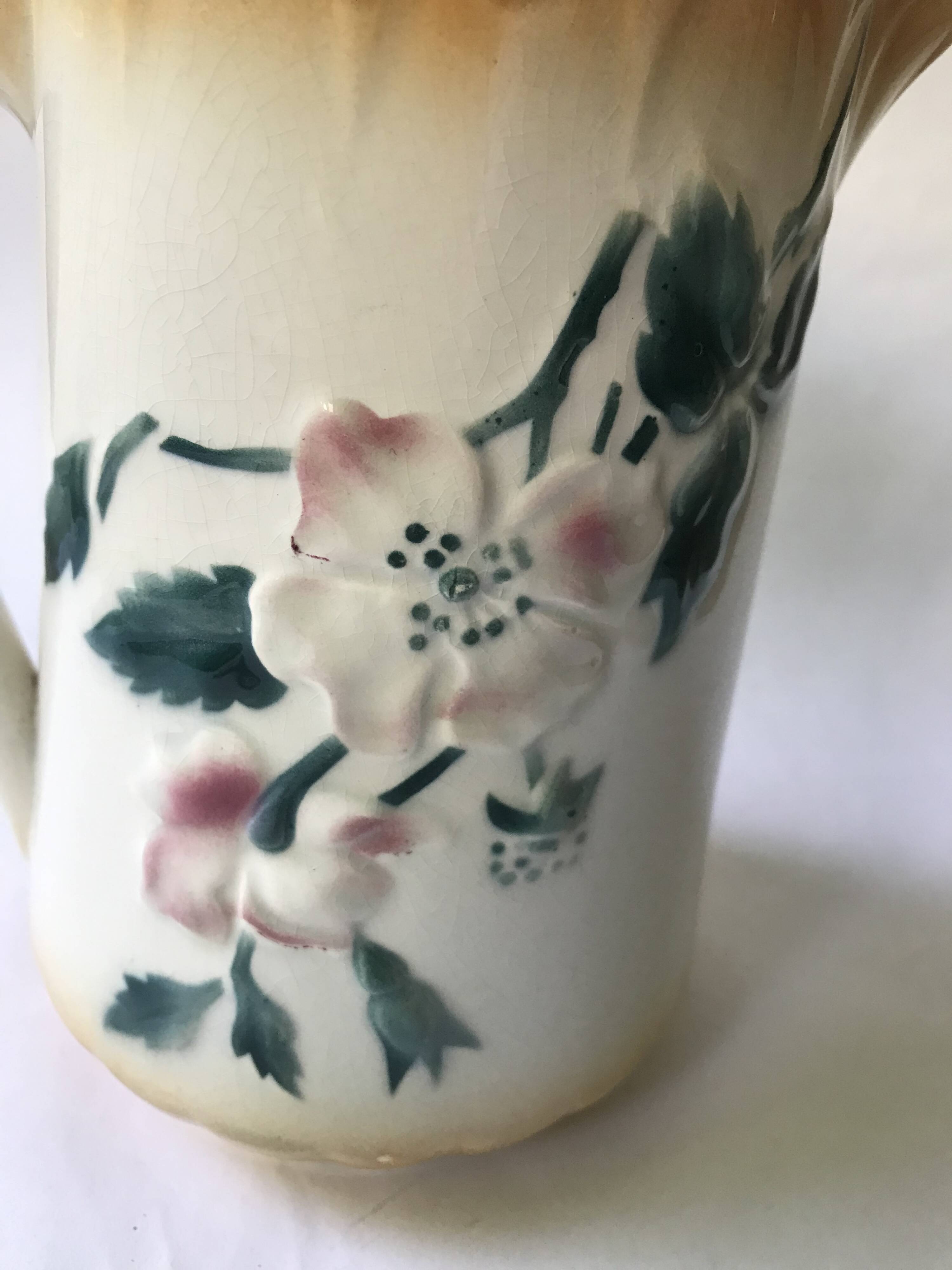 Antique barbotine pitcher with floral decoration numbered 548
