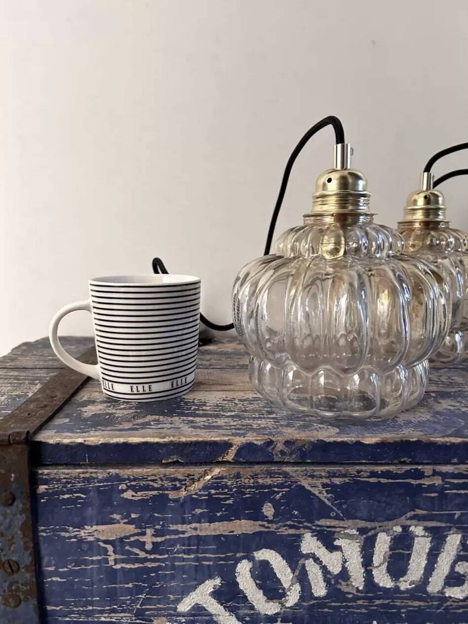 Set of two amber glass pendant lights