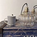 Set of two amber glass pendant lights