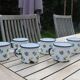 Enamelled sheet metal cups
