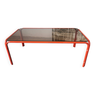 Coffee table in smoked glass and orange tubing from the 70s/80s