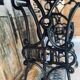 Vintage wooden table with a cast iron base.