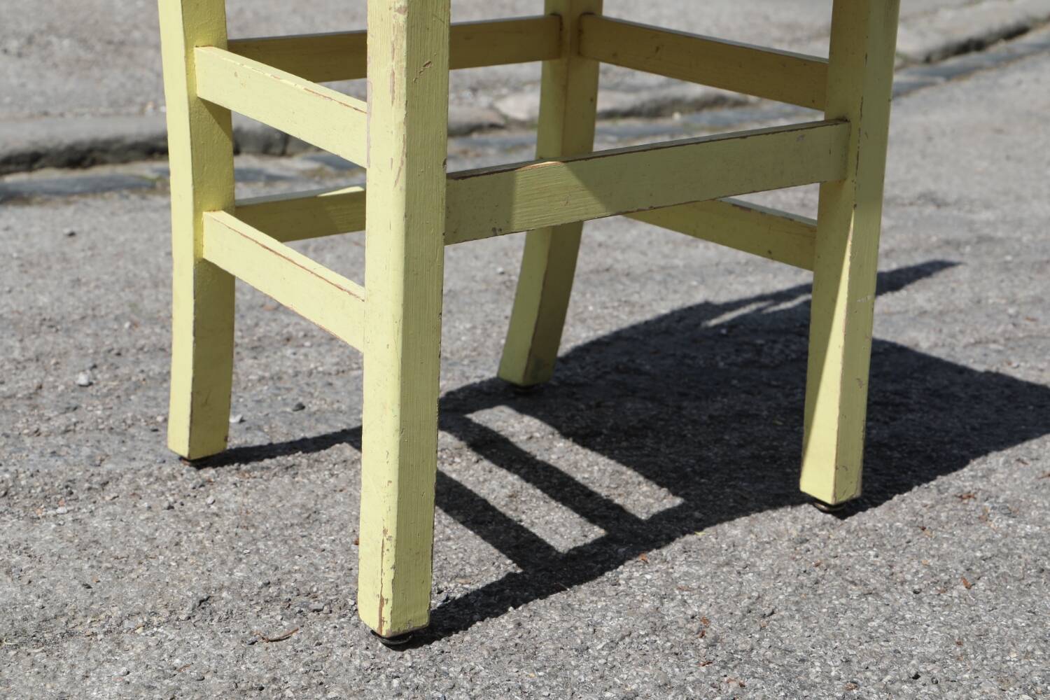 Formica and yellow wood chair
