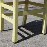 Formica and yellow wood chair