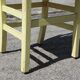 Formica and yellow wood chair