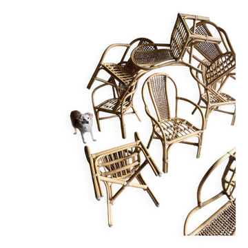 Set of 8 Manou rattan chairs with cane backrest.
