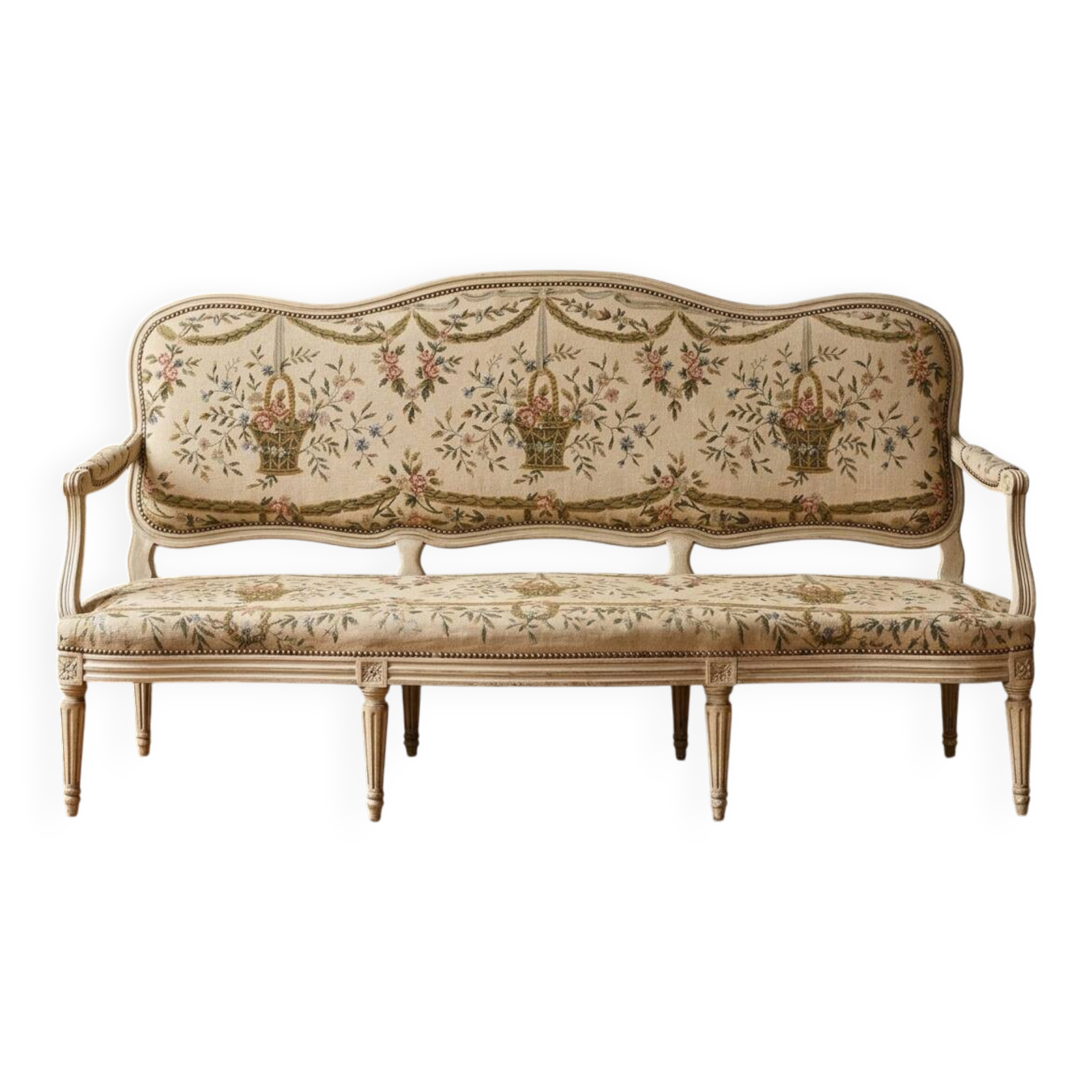 Louis XV style canapé in carved natural wood and floral upholstery.