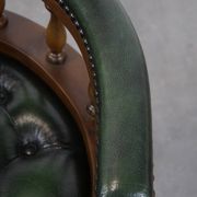 Dark green cowhide leather and wood chesterfield office chair on wheels