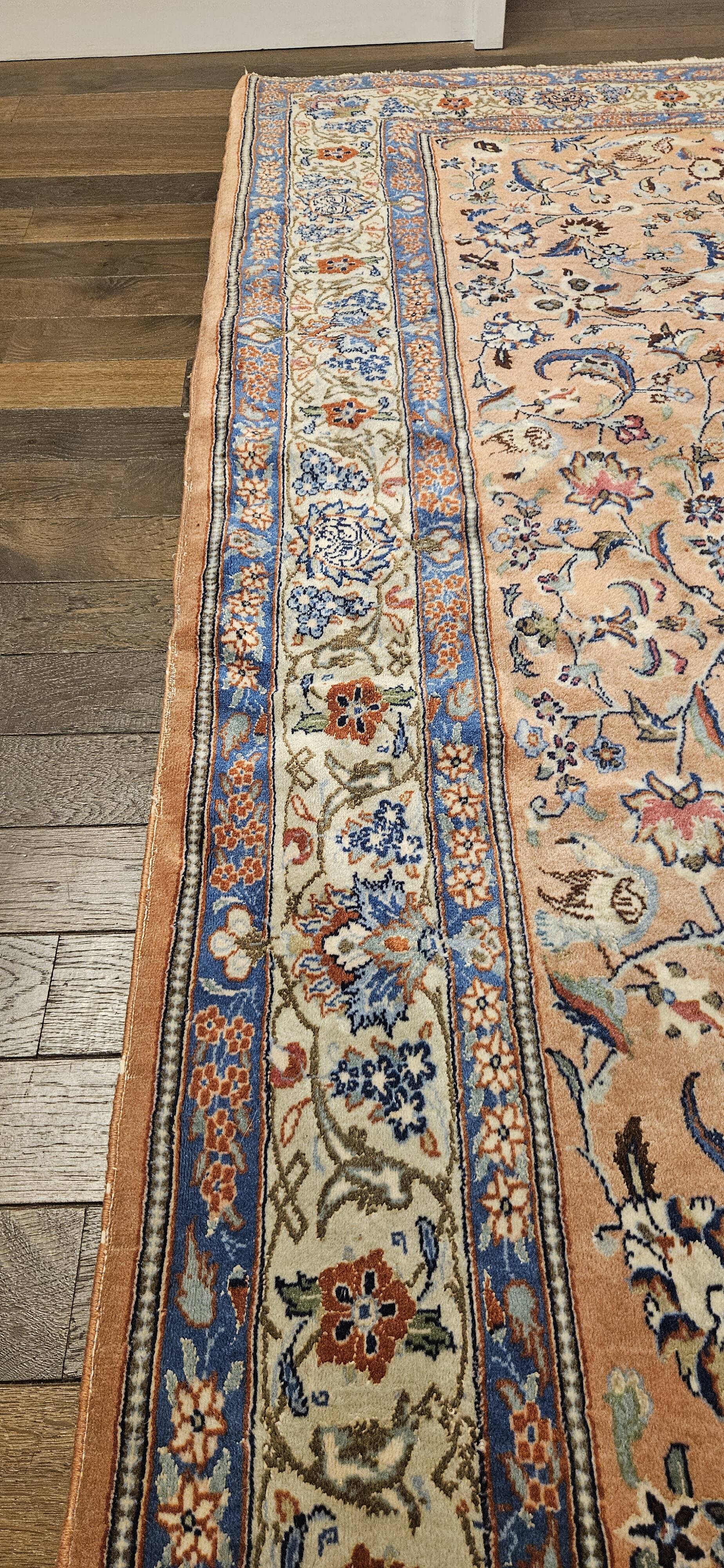 Large wool and silk oriental carpet.