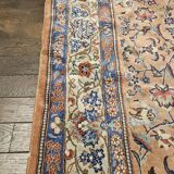 Large wool and silk oriental carpet.