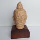 Tête de Bouddha en terre cuite