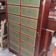 Empire-style mahogany cabinet – 12 drawers lined with green leather –