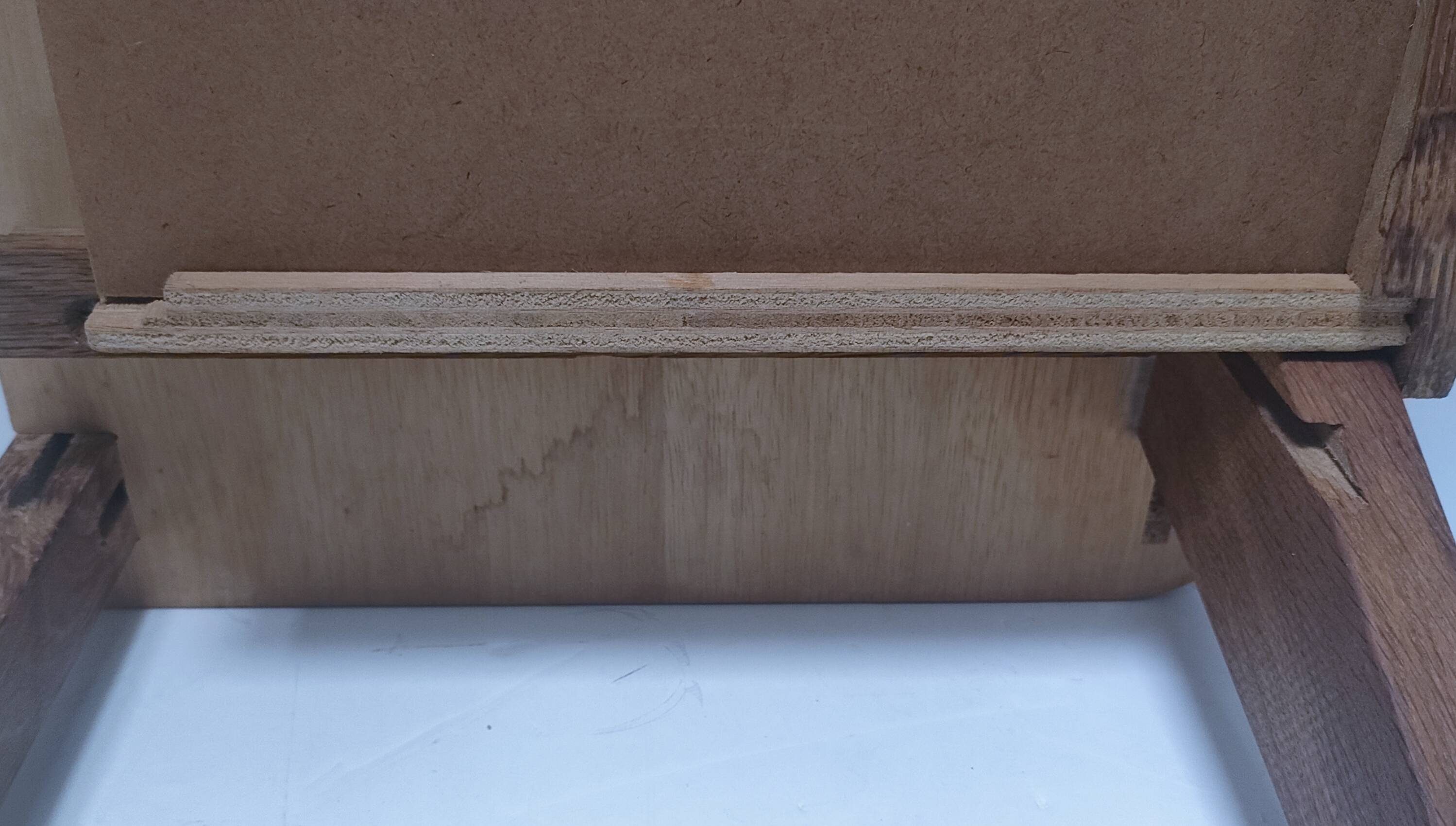 vintage wooden bedside table with crossbars and tapered legs