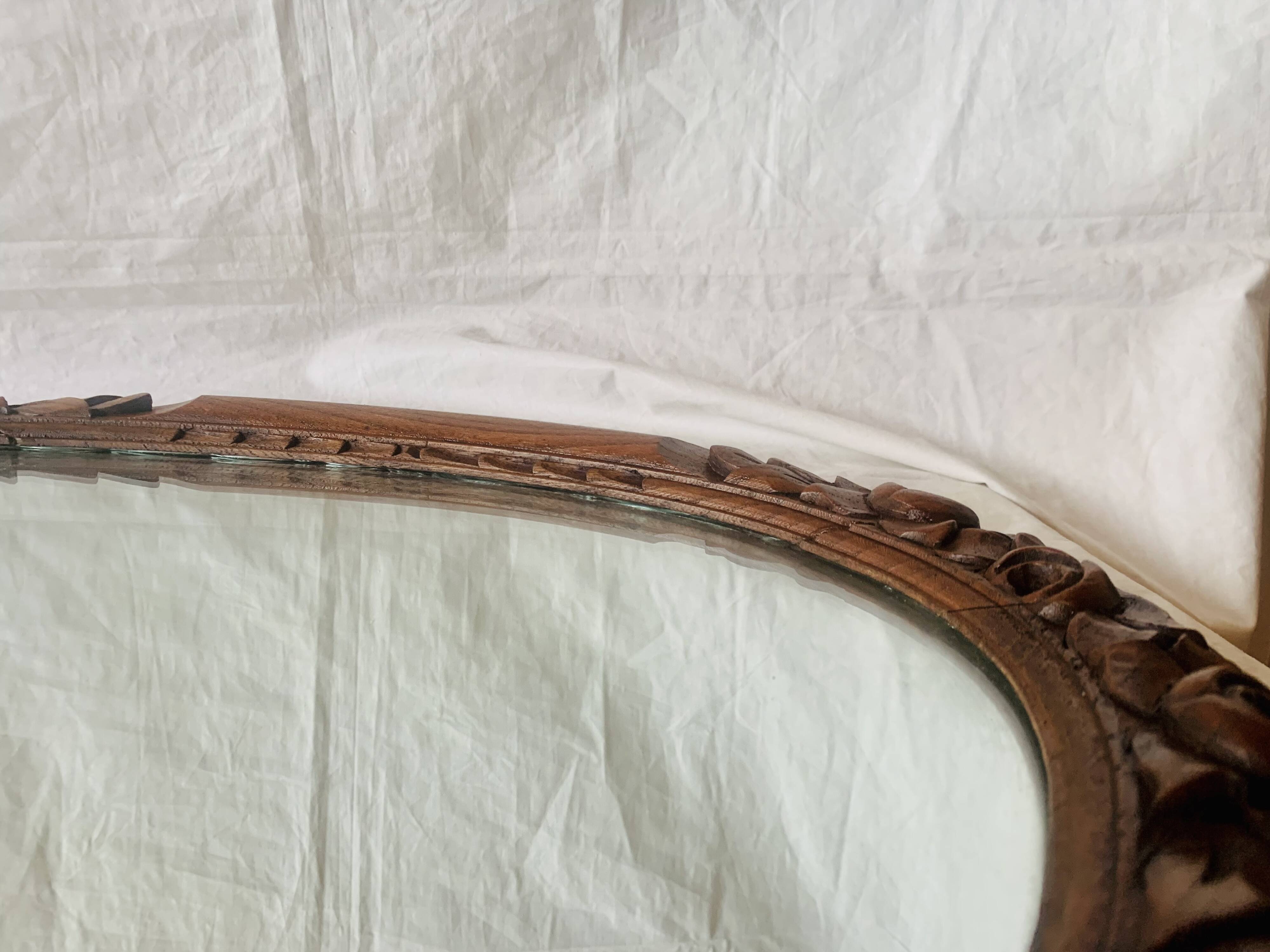 Large Art Deco oval mirror in carved wood - 87 x 53 cm