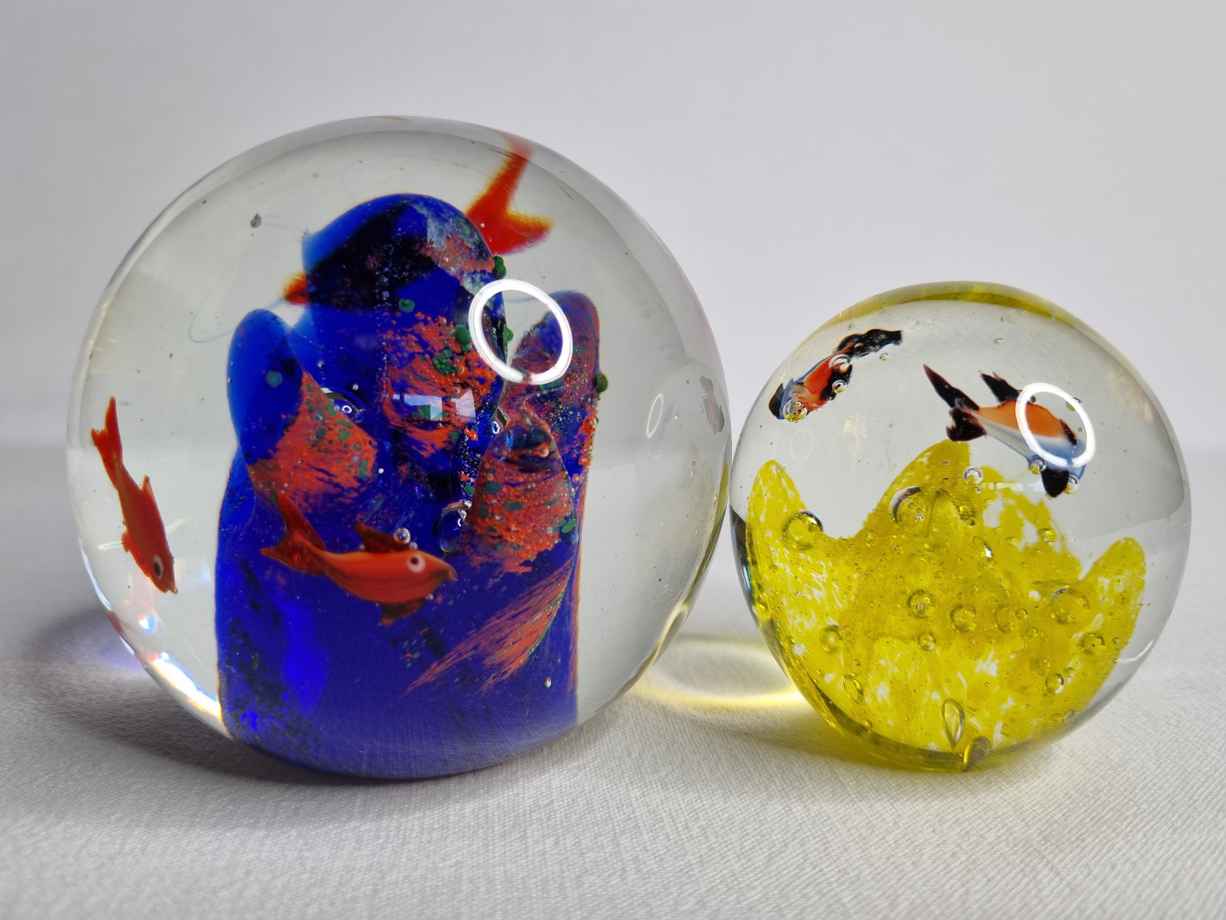 Set of two sulphides, glass paperweight with fish decorations