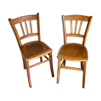 2 light wood bistro chairs