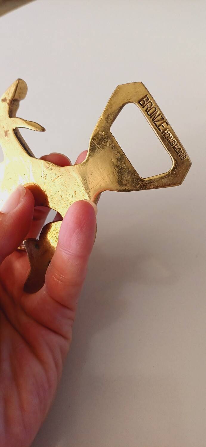 Animal bottle opener in gilded bronze