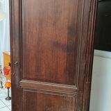 Bonnetière man standing cabinet a door