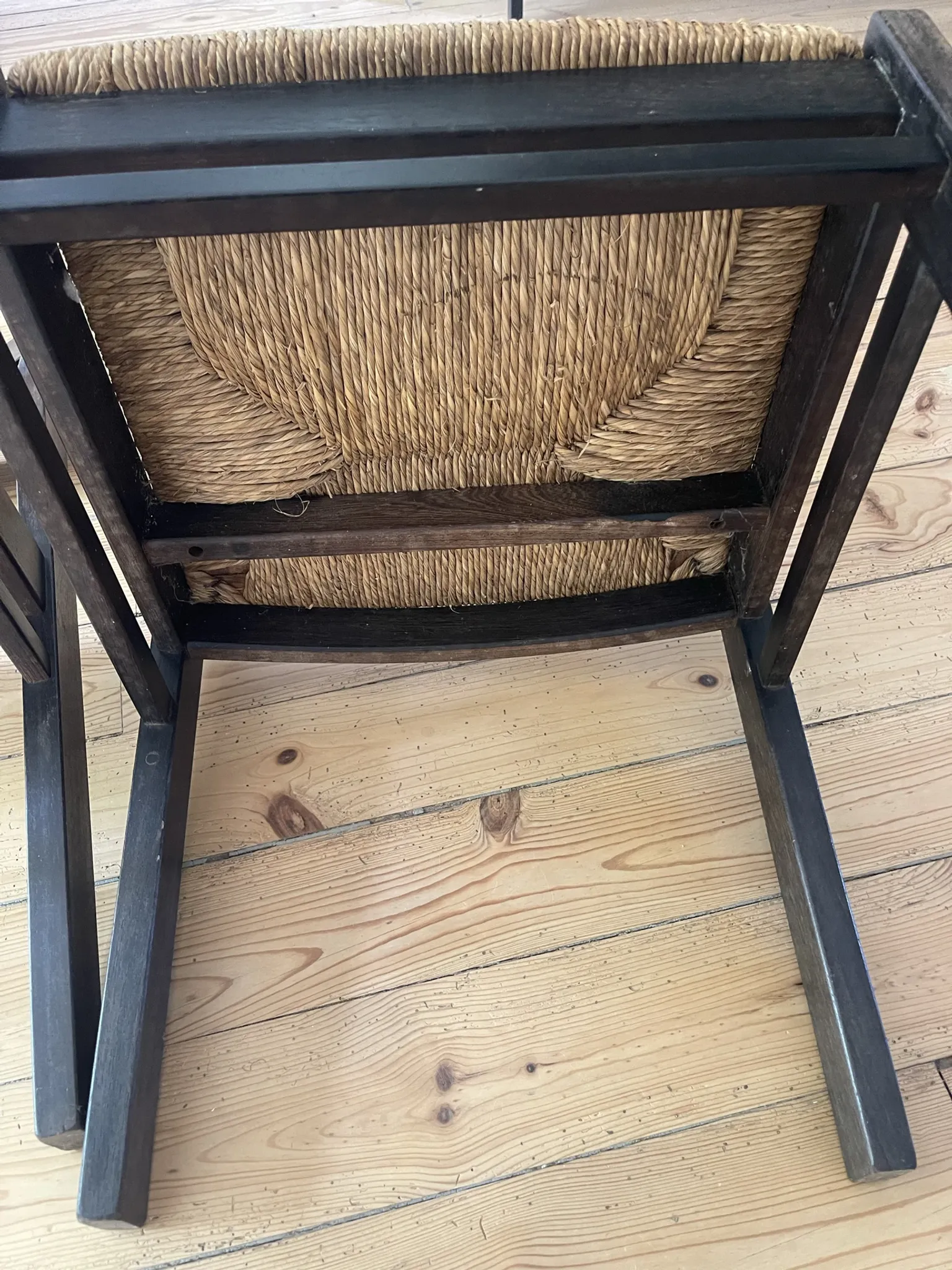 Pair of straw-seated wooden chairs in the regain style.