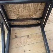 Pair of straw-seated wooden chairs in the regain style.