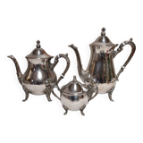Silver-plated coffee and tea service including a coffee pot, a teapot, and a sugar bowl.