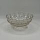 Vintage pressed glass footed coupe with scalloped diamond-cut edge.