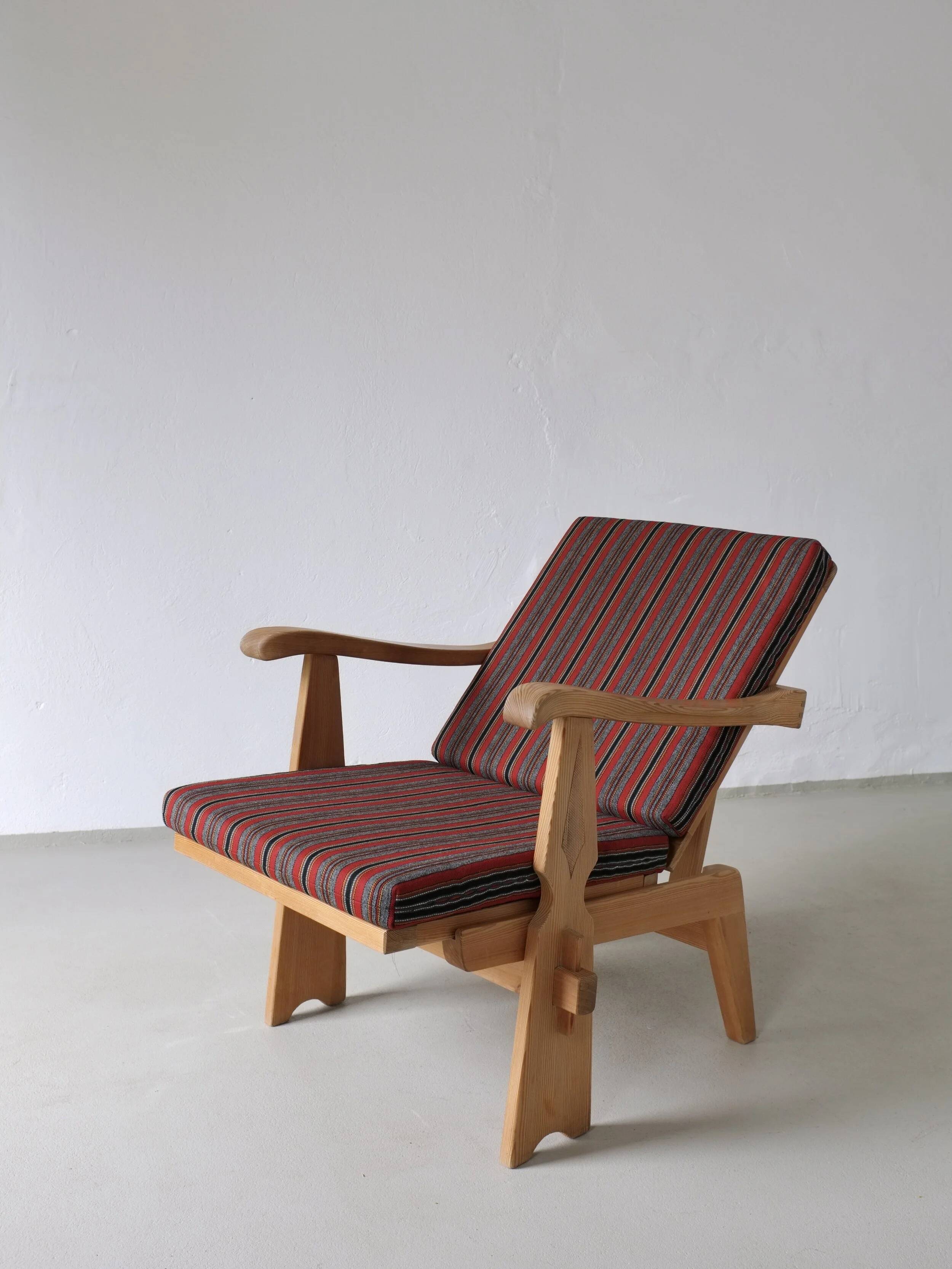 2 carved pine lounge chairs | Scandinavia | 1970s