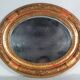 Antique oval mirror with original stucco and gilt wood frame, 37x31 cm. Beautiful patina.