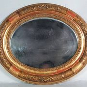 Antique oval mirror with original stucco and gilt wood frame, 37x31 cm. Beautiful patina.