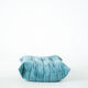 Ensemble de fauteuil et pouf Togo en velours côtelé bleu clair.