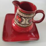 Red water pitcher and assorted plate