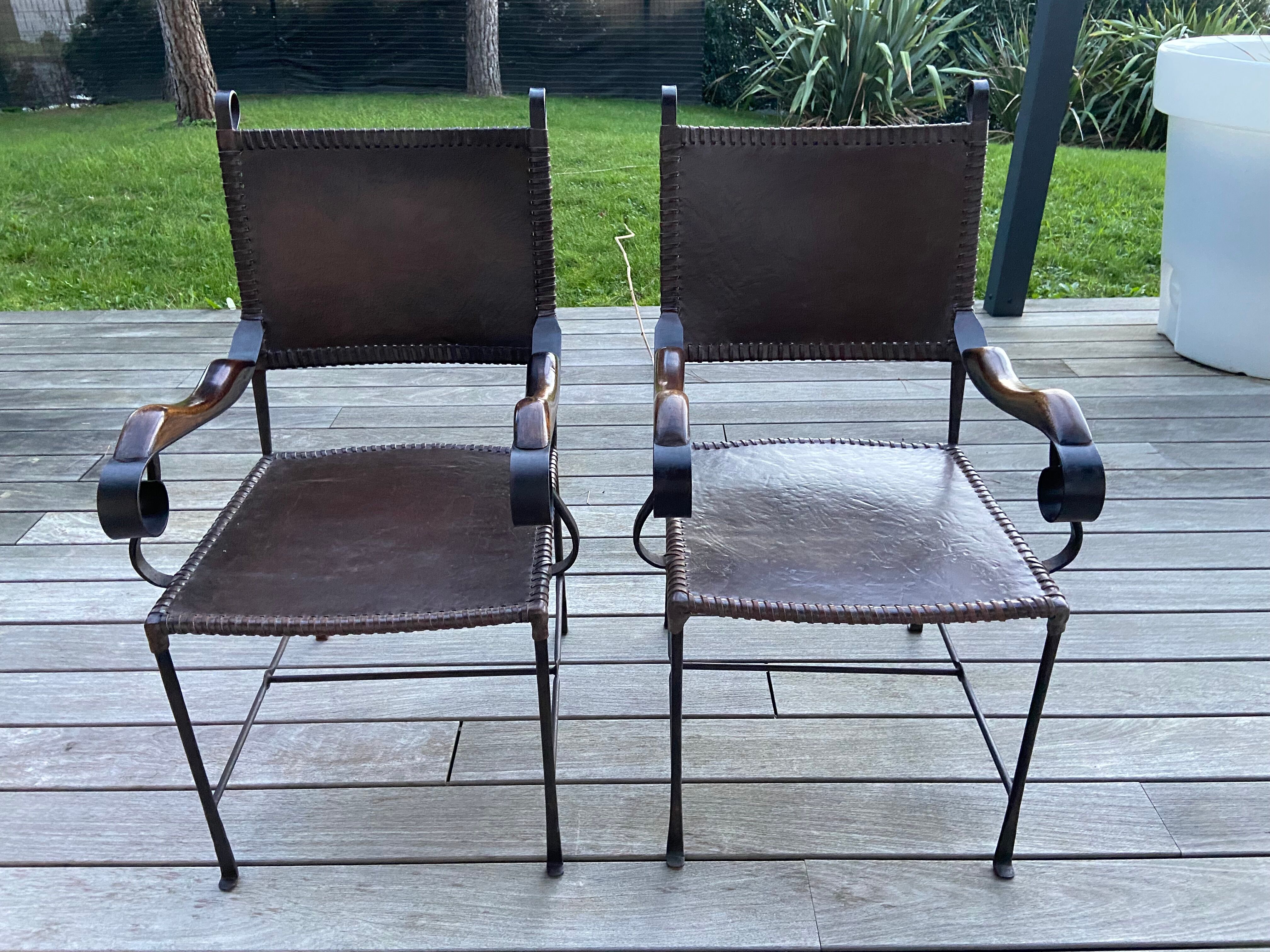 Leather and wrought iron armchairs