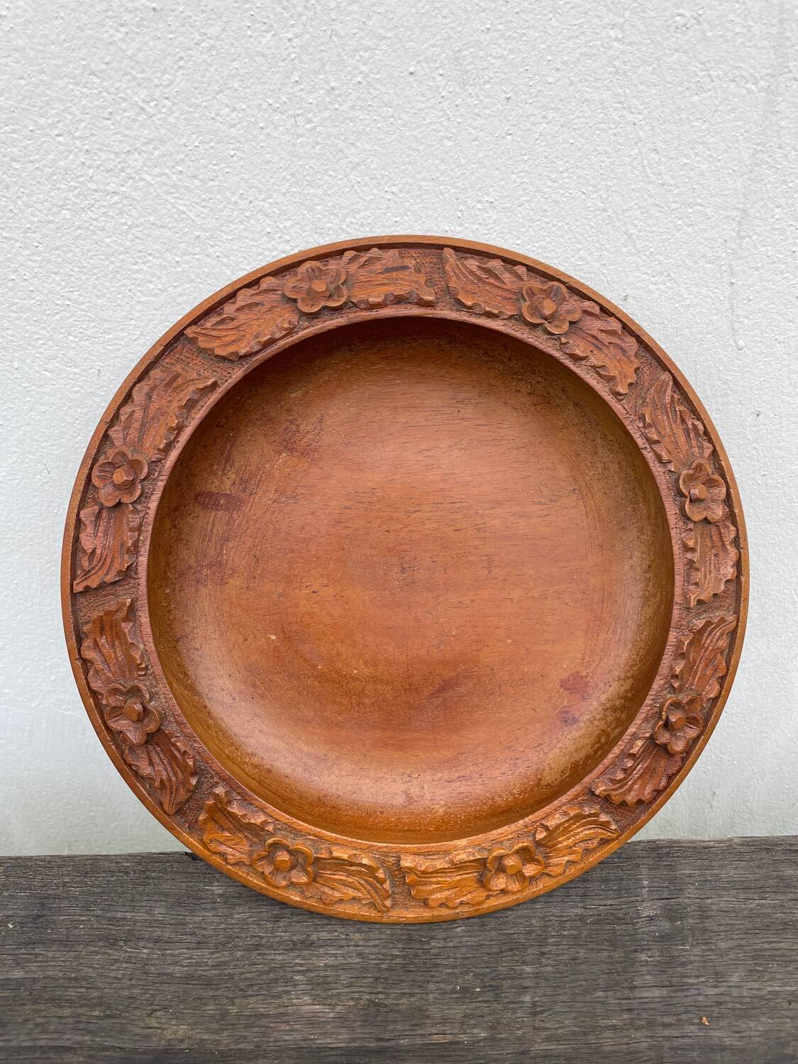 Carved wooden pocket emptier