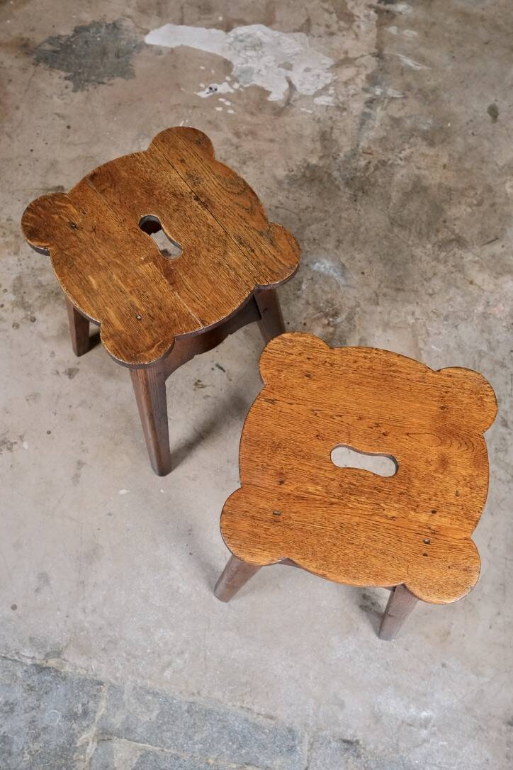 Pair of scalloped oak stools, France, early 20th century