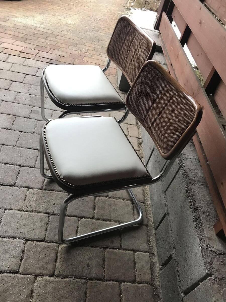 Set of 4 Mid-Century brown faux leather chairs with wood and chrome structure (1970s)
