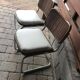Set of 4 Mid-Century brown faux leather chairs with wood and chrome structure (1970s)